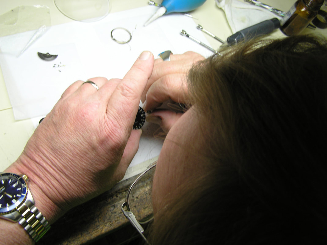Skilled professional working on a wrist watch